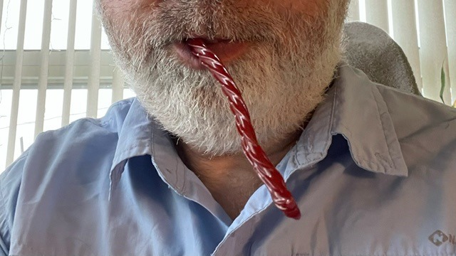 Twizzler licorice sticking out of my mouth.